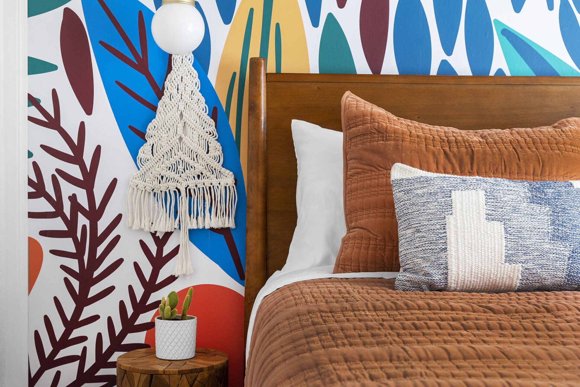 Master bedroom with colorful artwork and modern furnishings